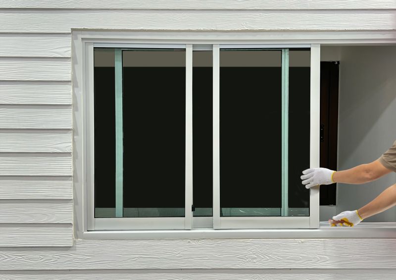 Repair Technician Inspecting Windows
